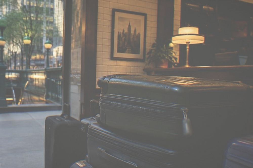 Interior of a New York shop with a luggage storage counter and stacked suitcases