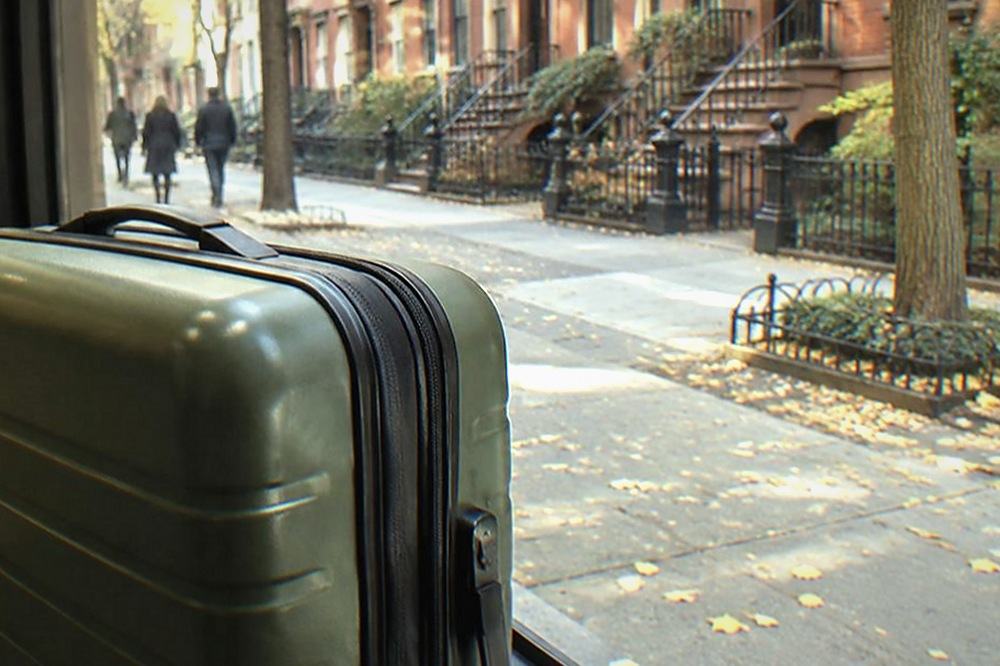 Sidewalk with brownstone buildings and shopfronts near Grand Central Terminal