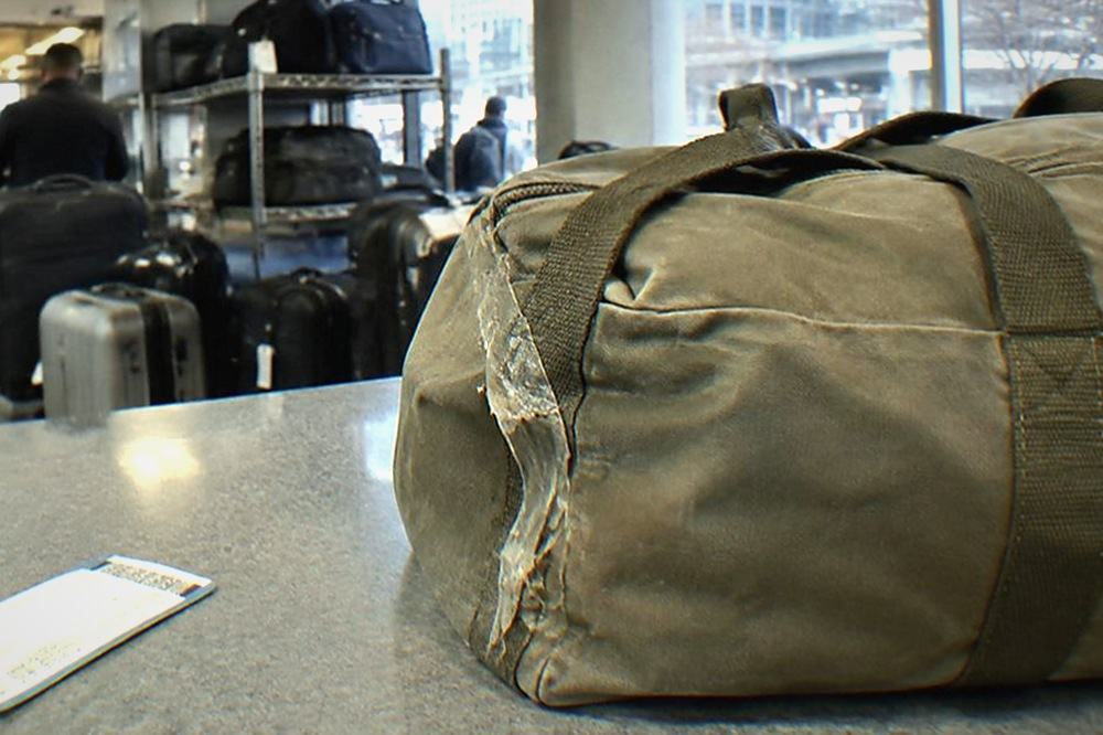 Storage counter area with stacked suitcases behind a service desk