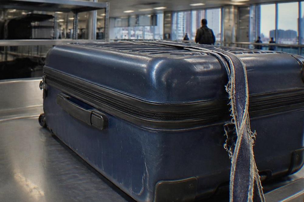 A staffed baggage storage counter in an airport terminal with a scale and a service sign.