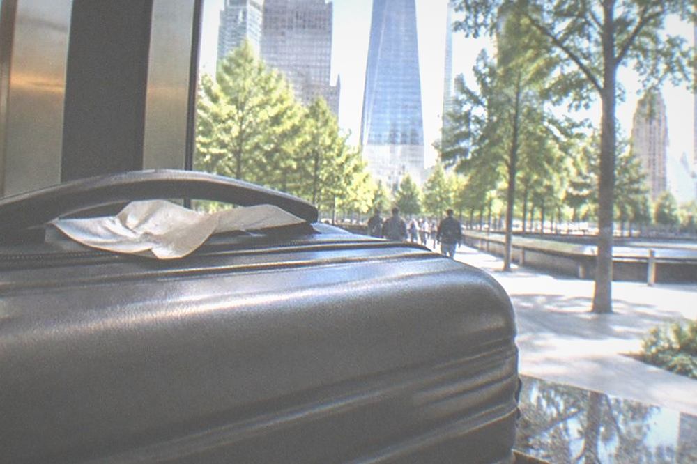 Downtown Manhattan street corner with modern office towers above
