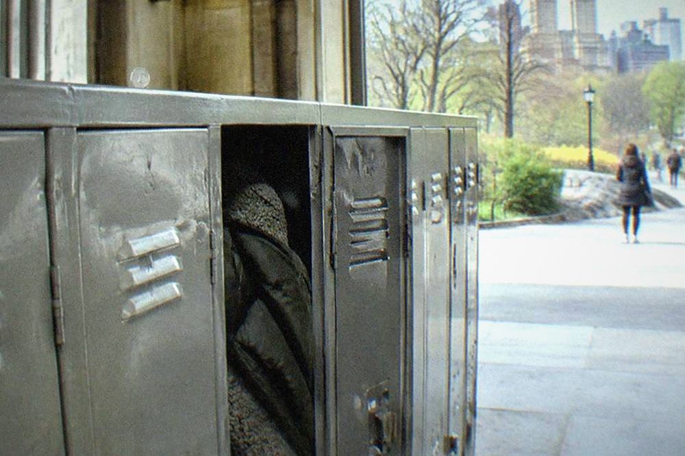 Row of metal day lockers in a museum lobby