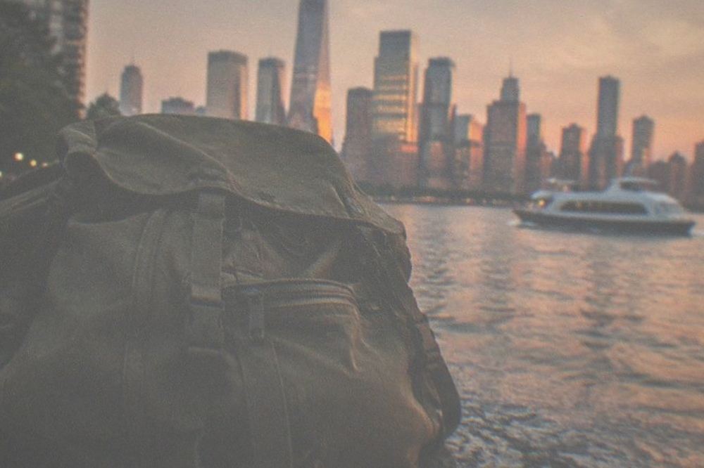 The Statue of Liberty from the ferry with the Manhattan skyline behind it