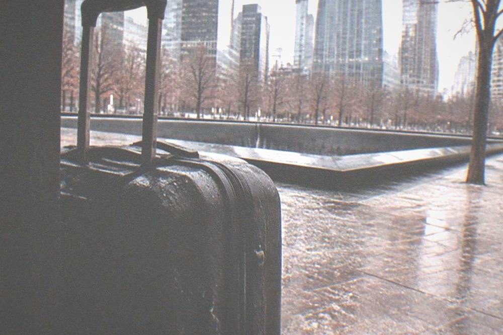 The reflecting pools of the 9/11 Memorial with the surrounding towers above