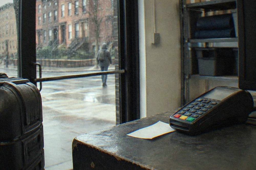 A receipt and a card reader on the counter of a small New York storage shop