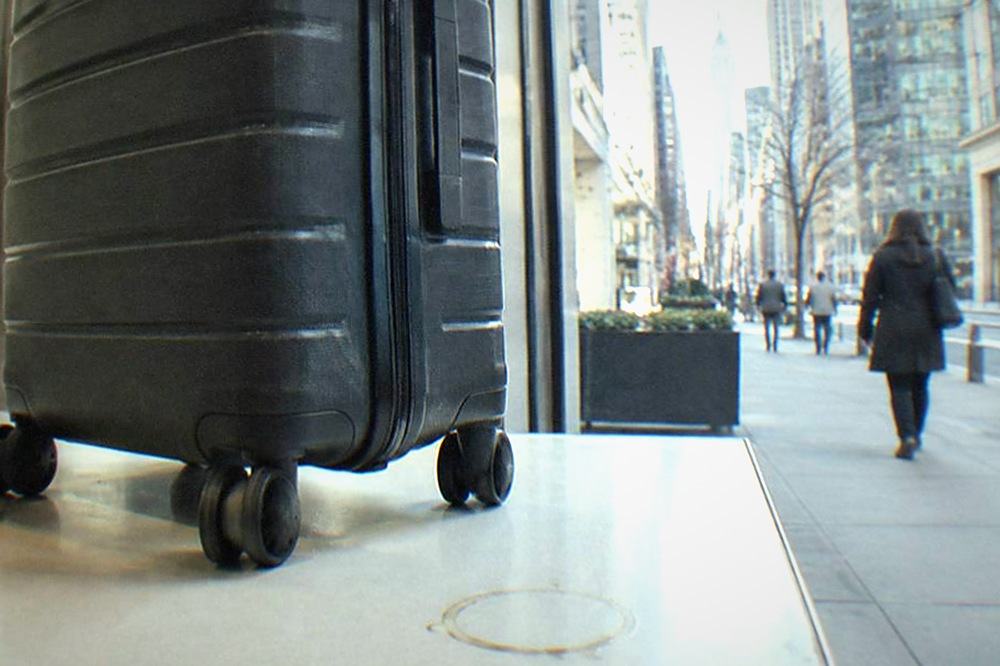 Manhattan sidewalk with a storefront bag storage counter in daylight